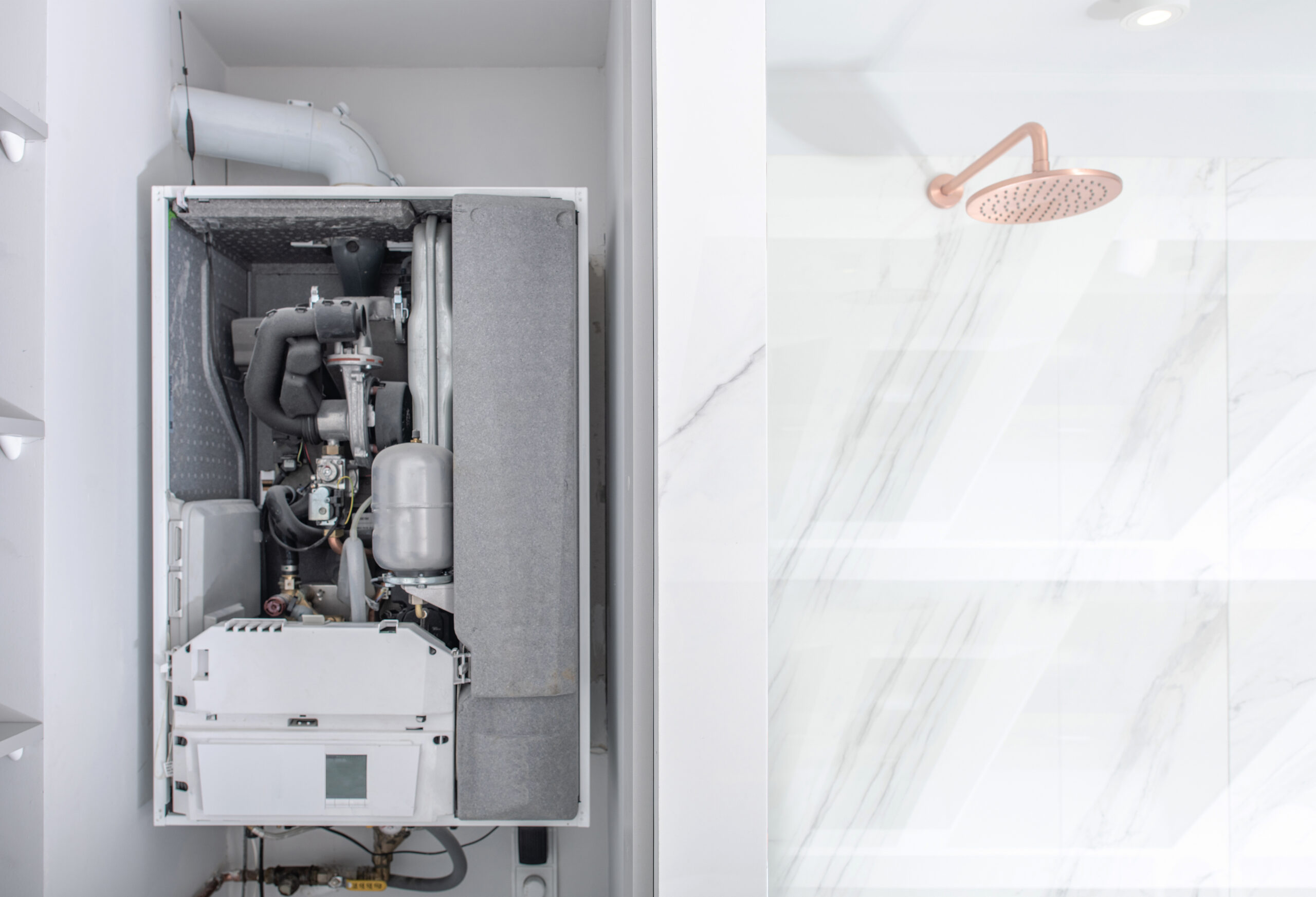 Broken Modern Water Gas Heater Next to Shower Cabin Inside Elegant Clean Bathroom Interior.